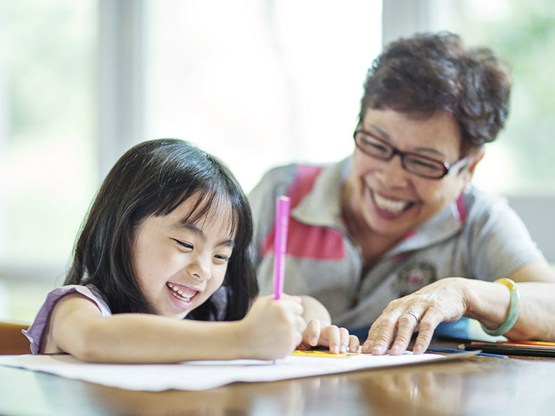 A child drawing on a piece of paper